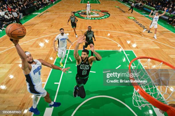 Jalen Suggs of the Orlando Magic drives to the basket during the game against the Boston Celtics on December 15, 2023 at the TD Garden in Boston,...