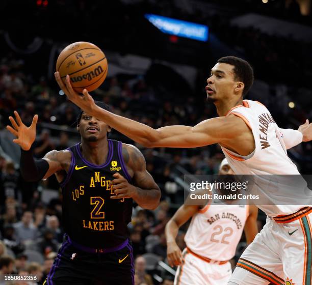 Victor Wembanyama of the San Antonio Spurs saves the ball from going out of bounds against the Los Angeles Lakers in the first half at Frost Bank...