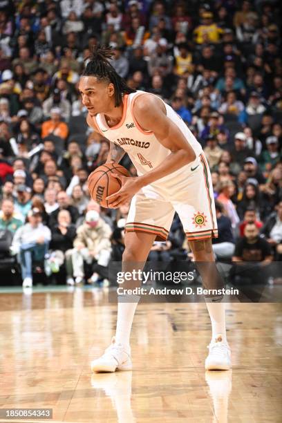 Devin Vassell of the San Antonio Spurs handles the ball during the game on December 15, 2023 at the Frost Bank Center in San Antonio, Texas. NOTE TO...