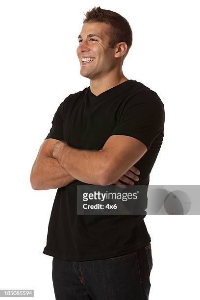 happy man standing with his arms crossed - three quarter length stock pictures, royalty-free photos & images