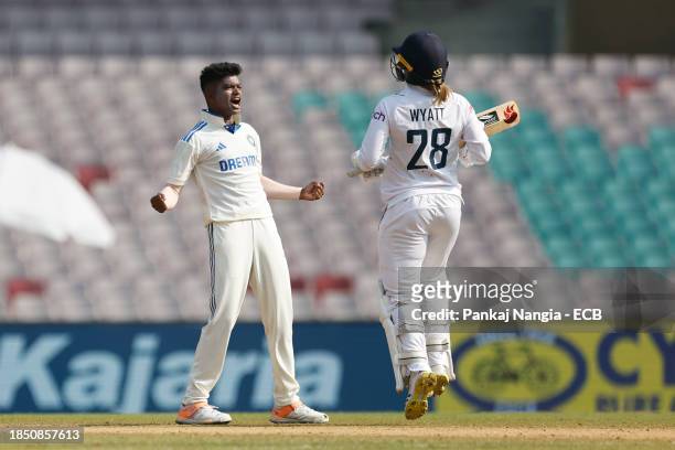 Pooja Vastrakar of India celebrates the wicket of Danielle Wyatt of England before being overturned by DRS review during day 3 of the Test match...