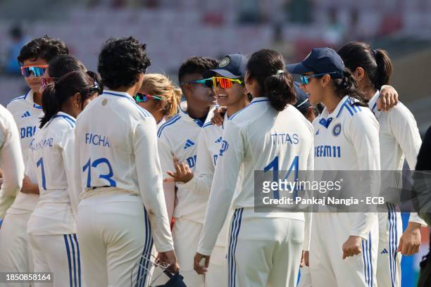 Players of India celebrate their team's win over England during day 3 of the Test match between India Women and England Women at DY Patil Stadium on...