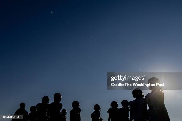 Northwest High School quarterback David Davis, right, watches teammates practice on Wednesday, October 4, 2023.