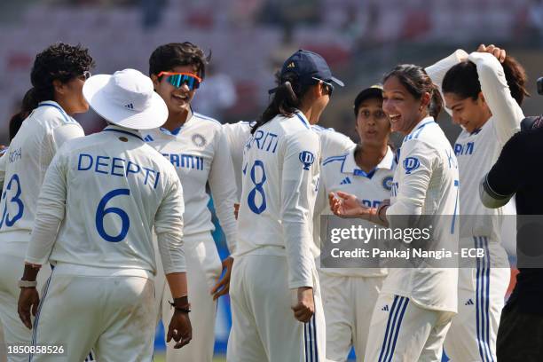 Players of India celebrate their team's win over England during day 3 of the Test match between India Women and England Women at DY Patil Stadium on...