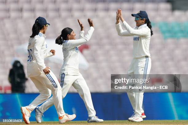 Players of India celebrate their team's win over England during day 3 of the Test match between India Women and England Women at DY Patil Stadium on...