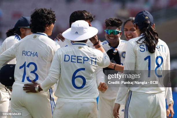 Players of India celebrate their team's win over England during day 3 of the Test match between India Women and England Women at DY Patil Stadium on...