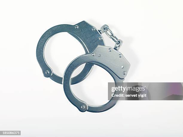 handcuffs - handboeien stockfoto's en -beelden