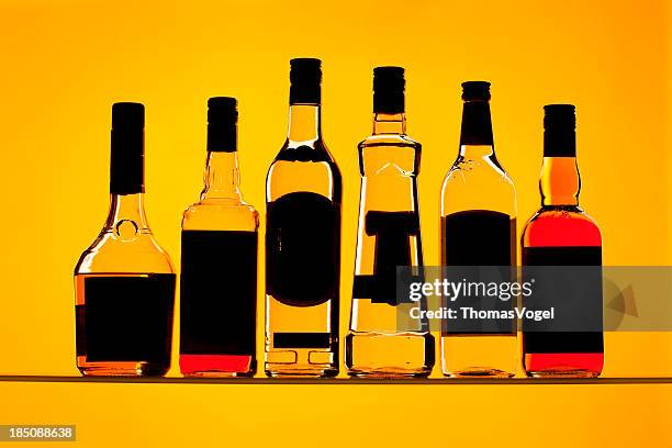 backlit alcohol bottles - alcohol drink stock pictures, royalty-free photos & images