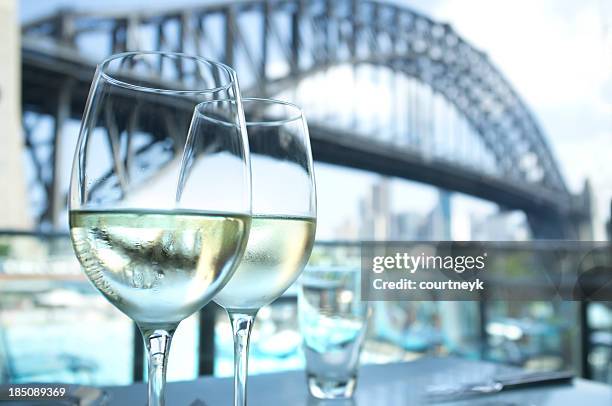 restaurant with sydney harbour bridge in the background - ports nsw stock pictures, royalty-free photos & images