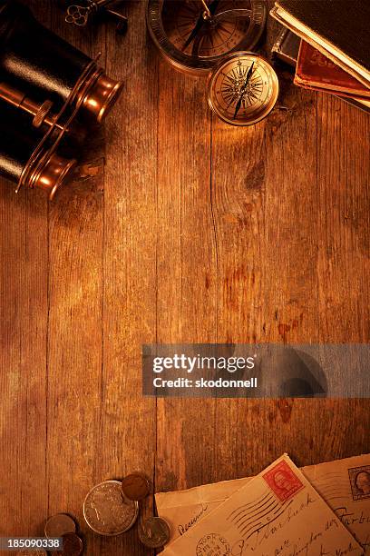 antique objects on a old wooden desk - old wooden table stock pictures, royalty-free photos & images