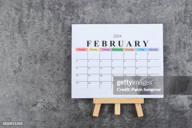 calendar desk 2024: february is the month for the organizer to plan and deadline with a wooden table background. - febrero fotografías e imágenes de stock