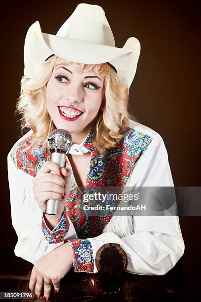 cowgirl with piercing singing - country and western music stock pictures, royalty-free photos & images