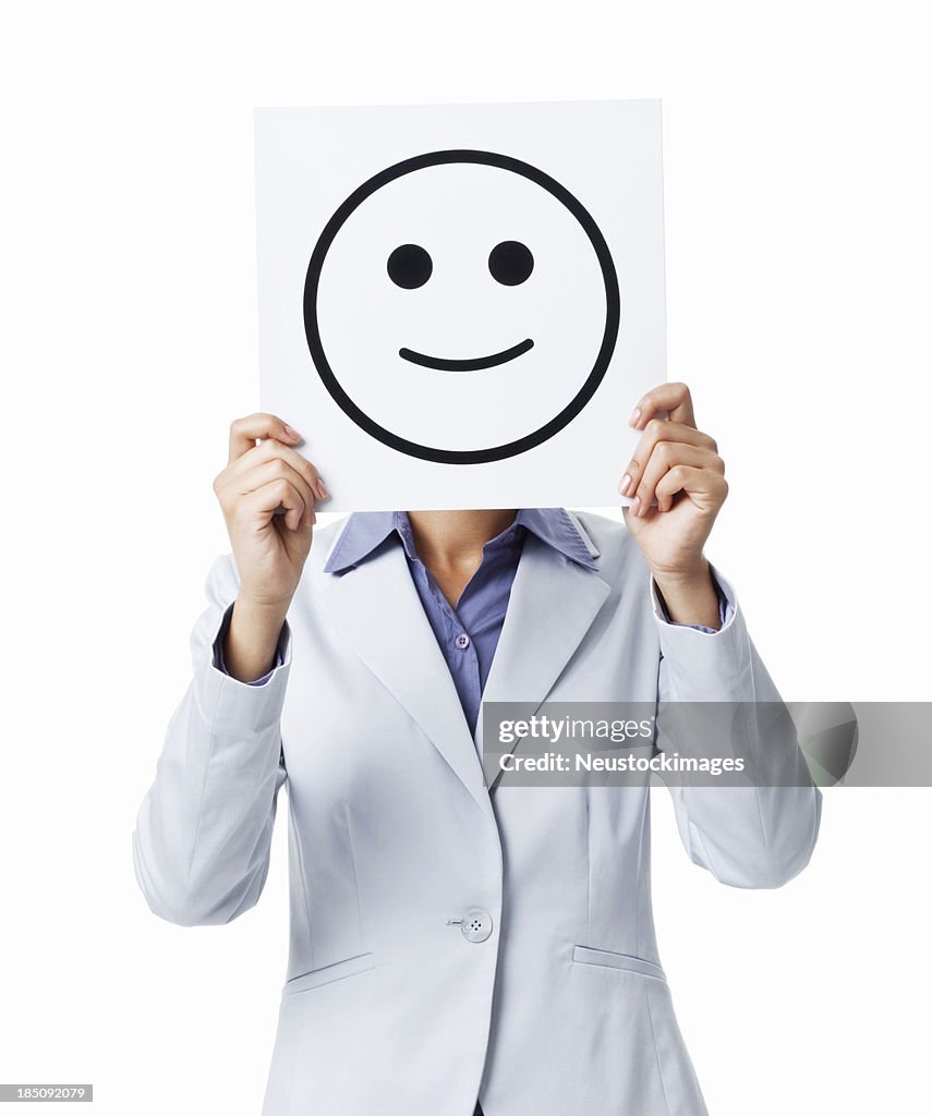 Businesswoman Holding Happy Smiley Face Sign- Isolated