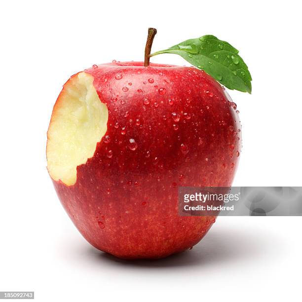 bite on a red apple - apple bite out stock pictures, royalty-free photos & images