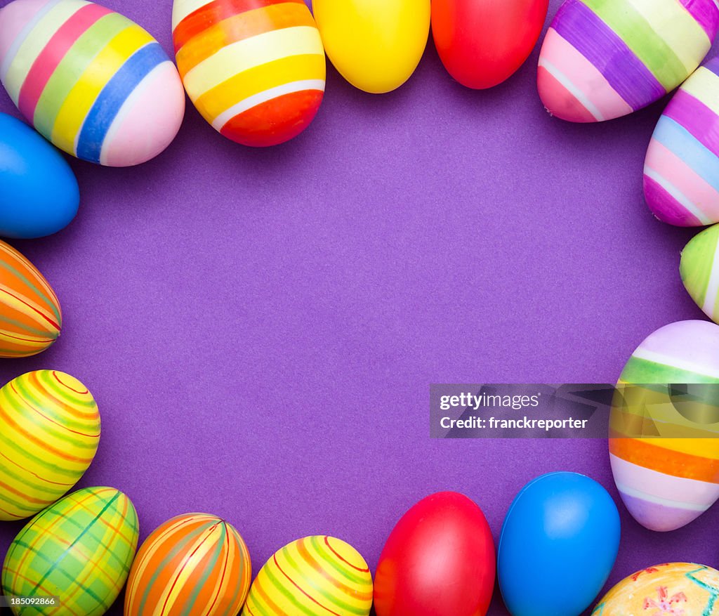 Colored Painted easter egg on purple background