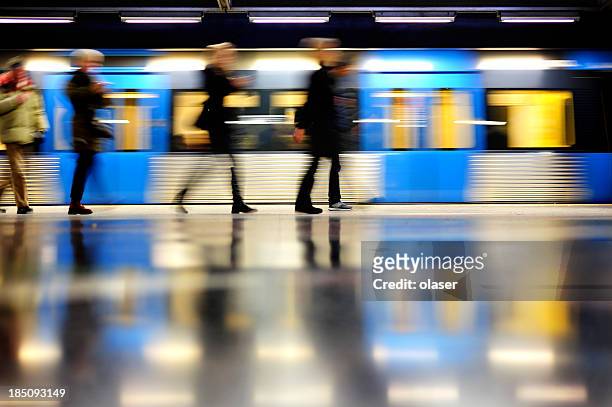 subway train in profile, and commuters - stockholm stock pictures, royalty-free photos & images