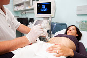 Doctor is performing liver biopsy to women...supporting with Ultrasound
