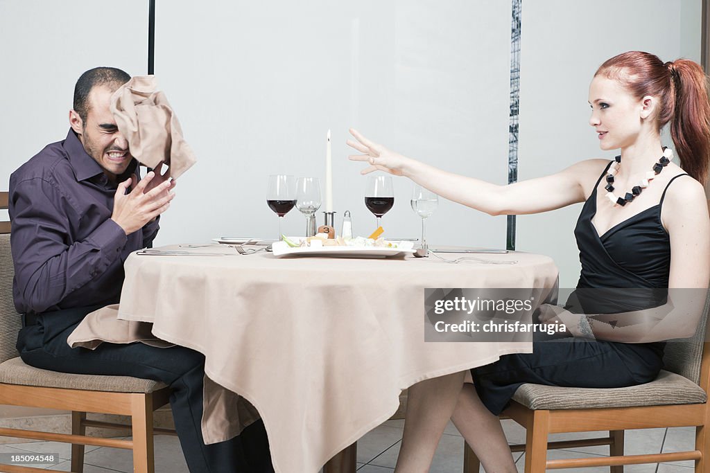 Young couple fighting during a meal