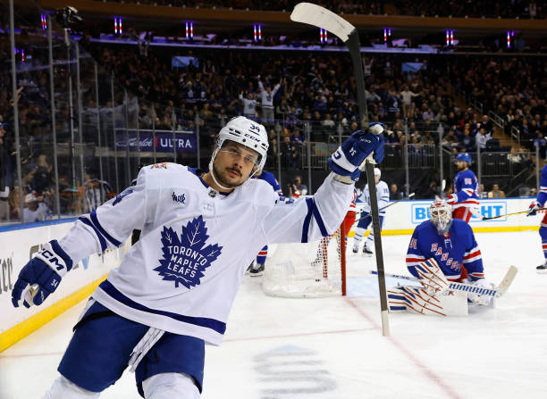 Auston Matthews of the Toronto Maple Leafs scores at 3:52 of the first period against Igor Shesterkin of the New York Rangers at Madison Square...