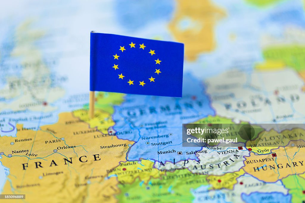 European Union flag over Europe map
