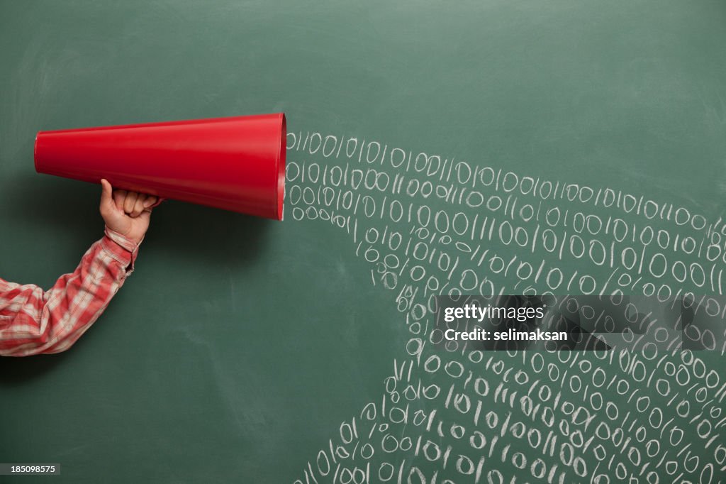 Megaphone with a chalkboard making noise for communication.