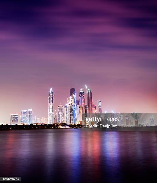 illuminated dubai marina at night united arab emirates - dubai marina stock pictures, royalty-free photos & images