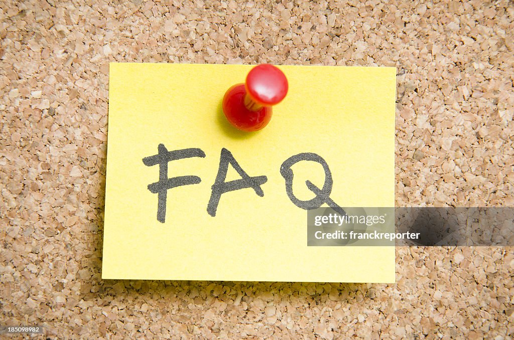 FAQ Post it note on a wood cork wall