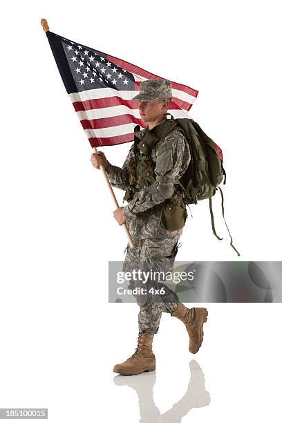 army man carrying an american flag - military rucksack stock pictures, royalty-free photos & images