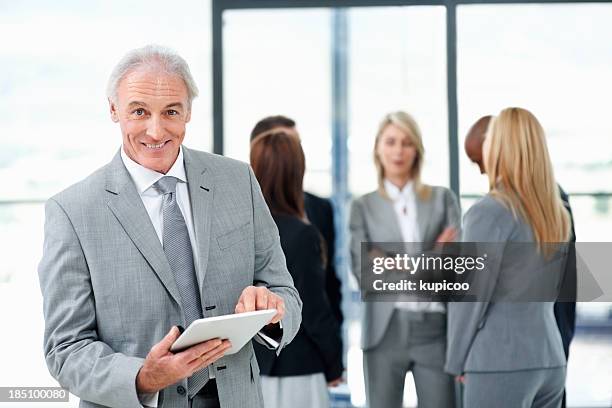 happy business man using tablet pc - peoples alliance for democracy stockfoto's en -beelden