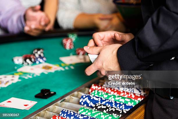 blackjack dealer hands in a casino - casino dealer stockfoto's en -beelden