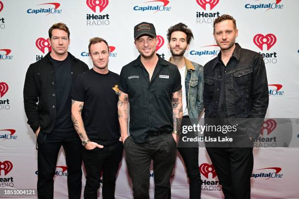 Zach Filkins, Eddie Fisher, Ryan Tedder, Brian Willett and Brent Kutzle of OneRepublic attend iHeartRadio Q102's Jingle Ball 2023 at Wells Fargo...