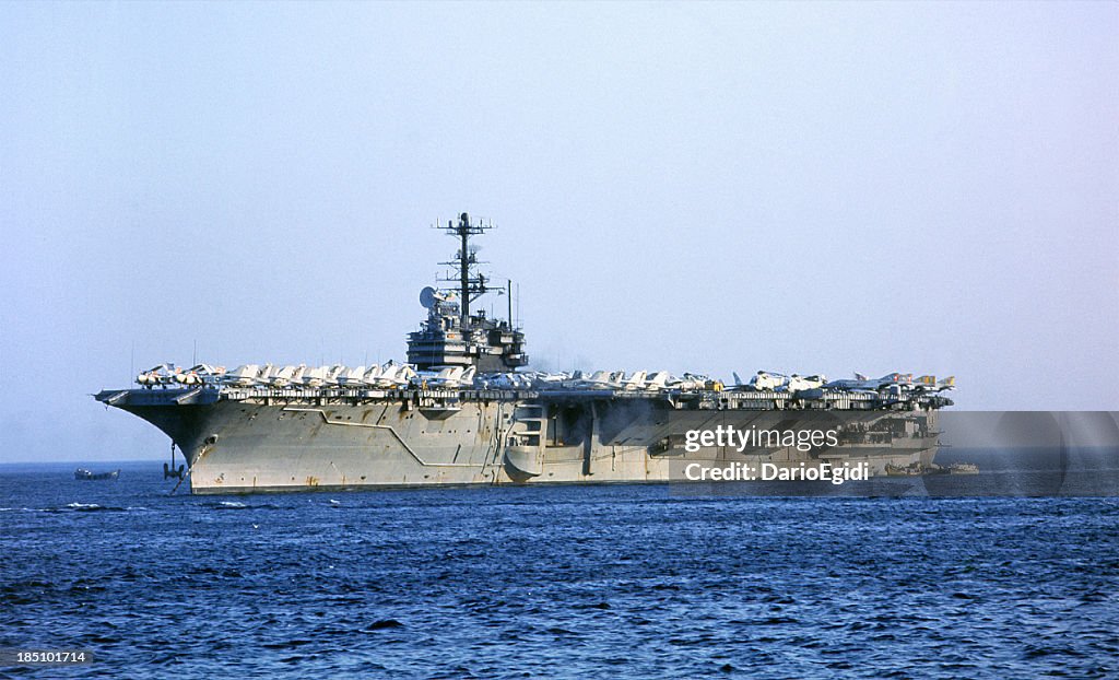 Aircraft carrier sailing in the open ocean