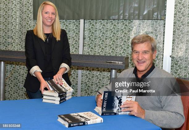Former Boston Bruins hockey player Bobby Orr signs copies of his autobiography "Orr: My Story" at Barnes & Noble Prudential Center on October 17,...