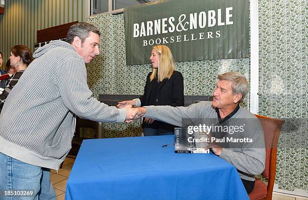 Former Boston Bruins hockey player Bobby Orr signs copies of his autobiography "Orr: My Story" at Barnes & Noble Prudential Center on October 17,...