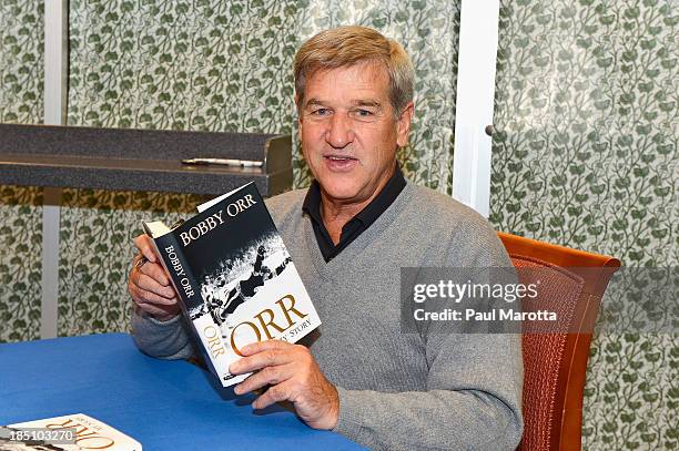 Former Boston Bruins hockey player Bobby Orr signs copies of his autobiography "Orr: My Story" at Barnes & Noble Prudential Center on October 17,...