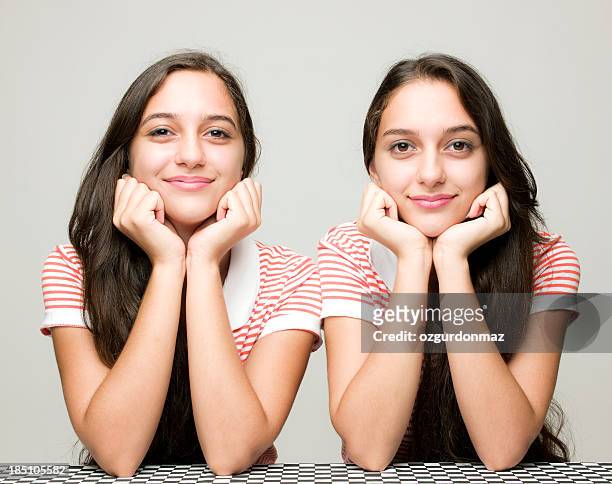happy twin sisters - twin stock pictures, royalty-free photos & images