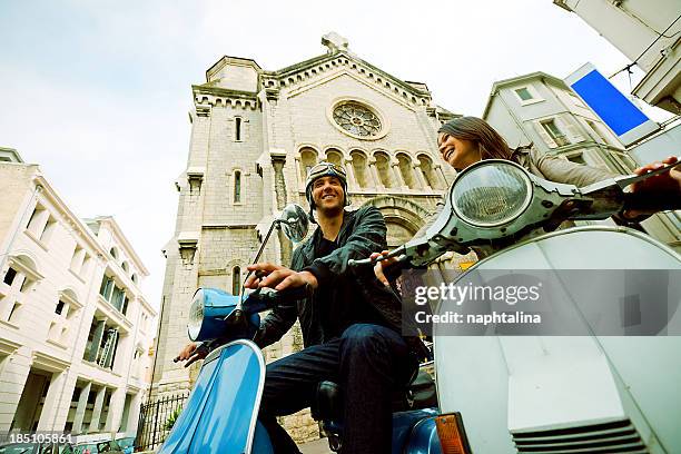 couple in cannes over scooter - cannes city stock pictures, royalty-free photos & images