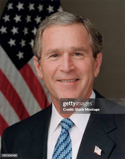 Portrait of American politician and US President George W. Bush as he poses for his Official Portrait in the Roosevelt Room of the White House,...