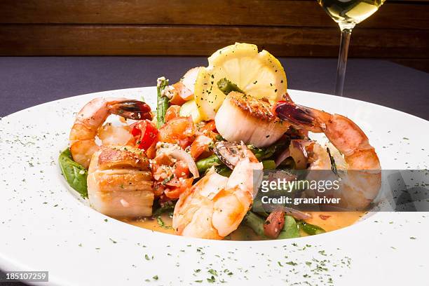 seafood scampi and white wine - scampi stock pictures, royalty-free photos & images