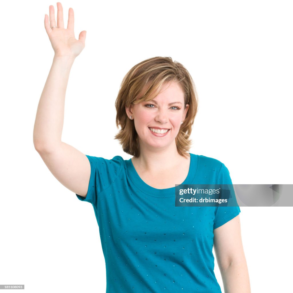 Young woman in a blue tee raising her hand to ask a question