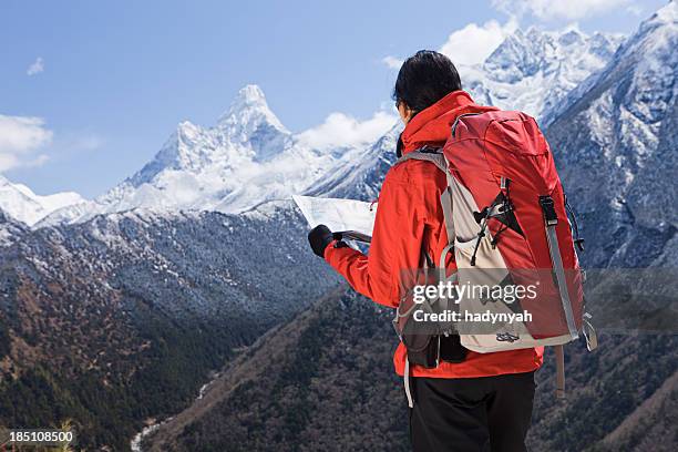 woman trekking in mount everest national park, nepal - glimpses of daily life in nepal stock pictures, royalty-free photos & images