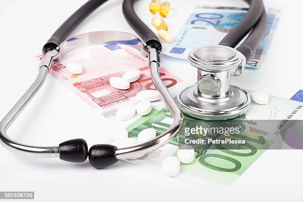 money for medicine. health expenses. stethoscope. - prescription drug costs stock pictures, royalty-free photos & images