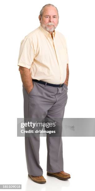 senior man standing with hands in pockets - old fat men stock pictures, royalty-free photos & images