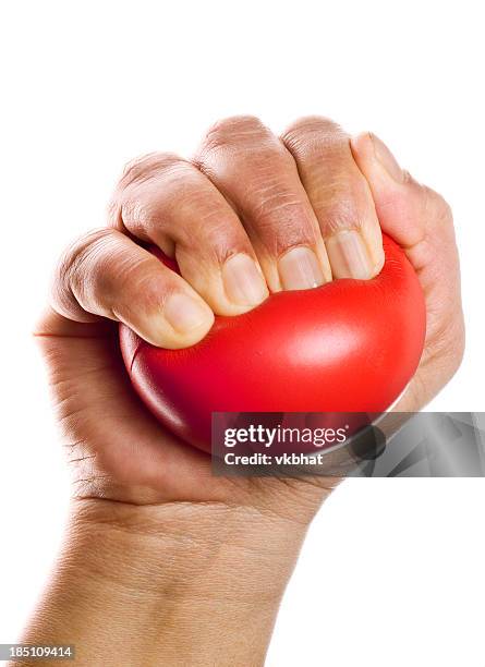 stress ball squeezing - stress ball stock pictures, royalty-free photos & images