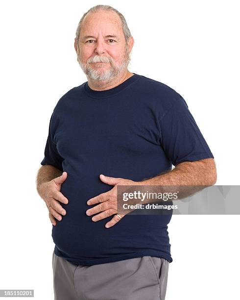 senior man holds stomach - belly rub stockfoto's en -beelden