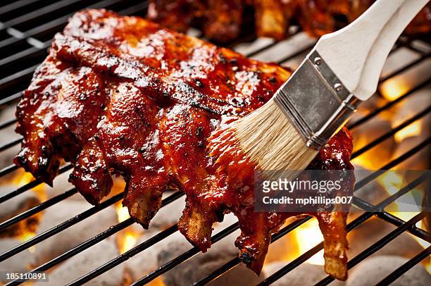 grilling ribs - sauce stock pictures, royalty-free photos & images