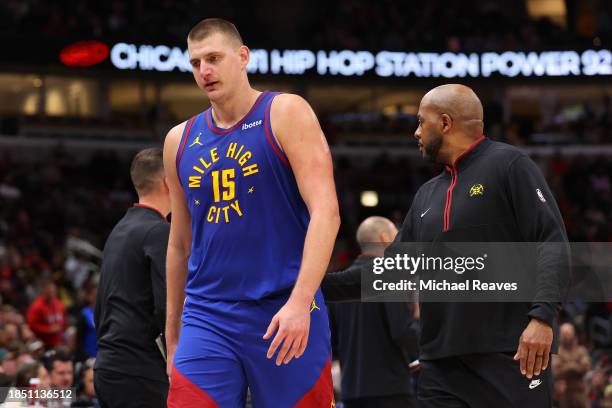 Nikola Jokic of the Denver Nuggets reacts after he was ejected from the game by referee Mousa Dagher against the Chicago Bulls during the first half...