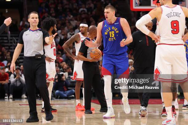 Nikola Jokic of the Denver Nuggets reacts after he was ejected from the game by referee Mousa Dagher against the Chicago Bulls during the first half...