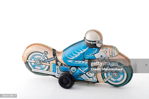 tin toys: motorcycle - crash helmet stock pictures, royalty-free photos & images