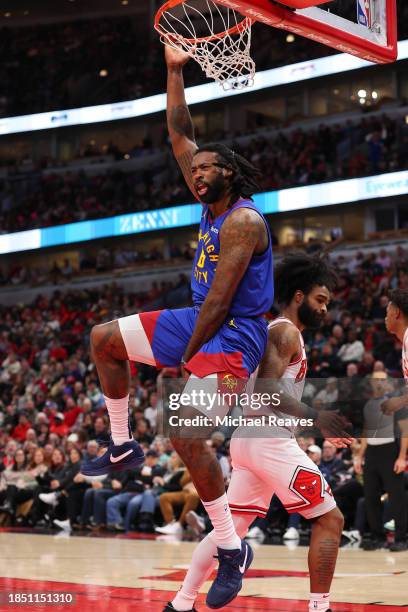 DeAndre Jordan of the Denver Nuggets celebrates a dunk against the Chicago Bulls during the first half at the United Center on December 12, 2023 in...